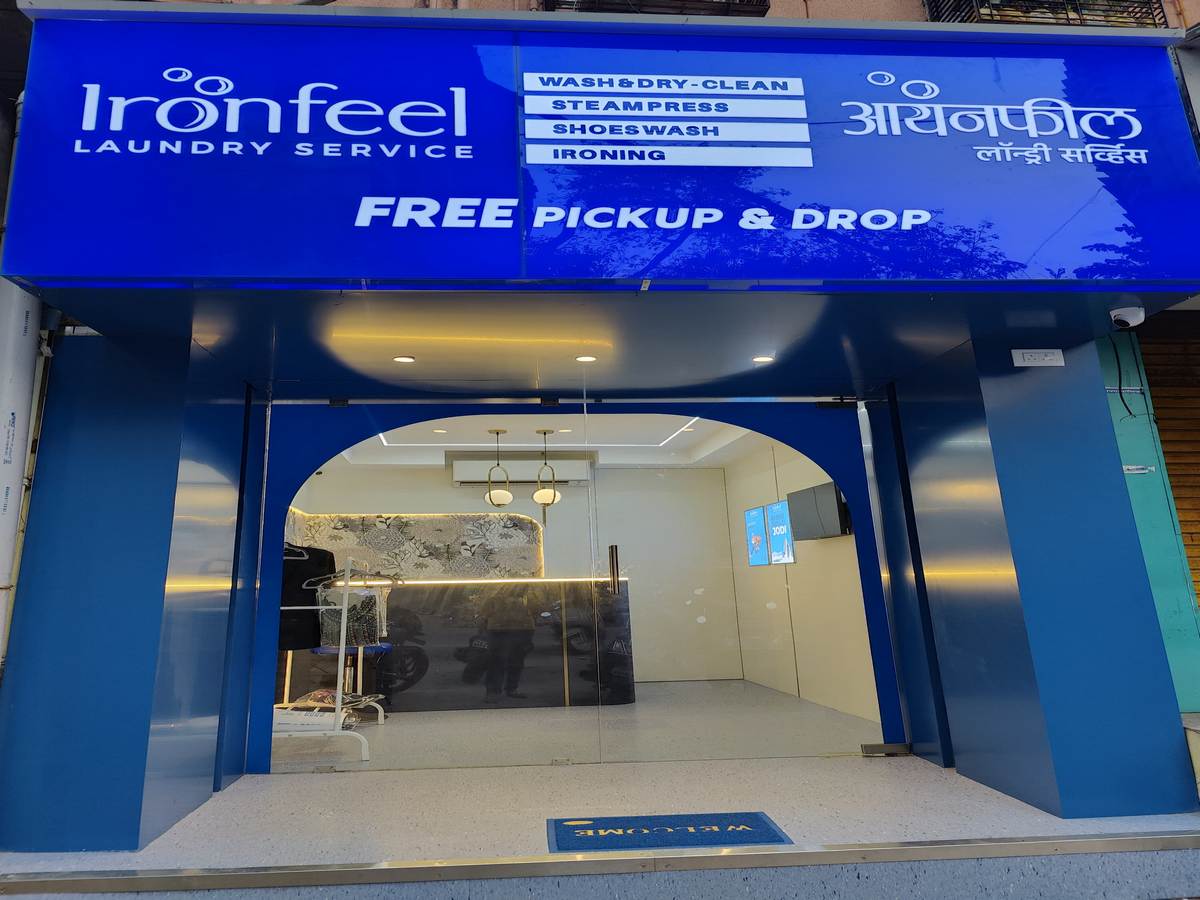 IronFeel Laundry Service storefront with free pickup and drop signage