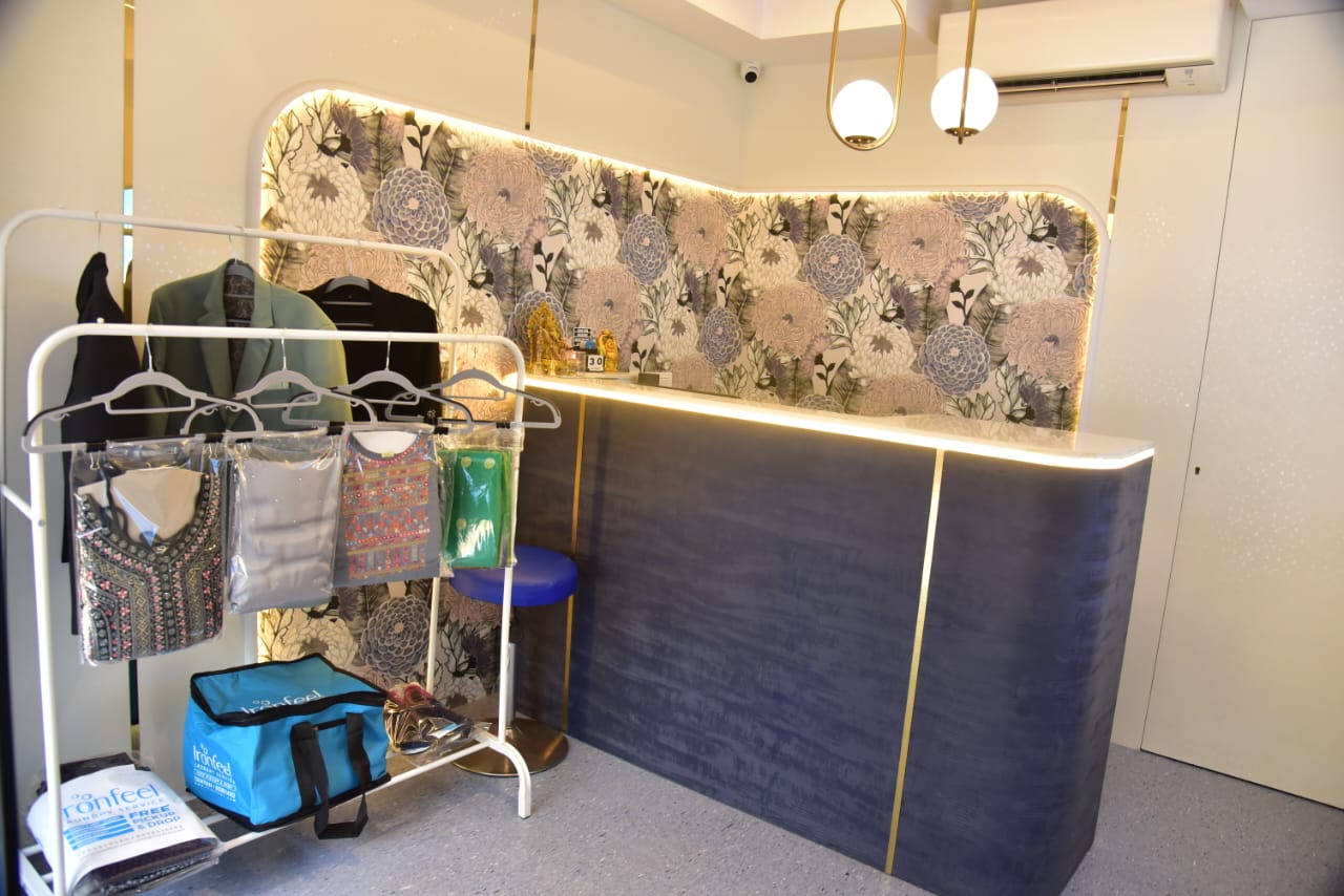 IronFeel store interior with garment rack and reception counter